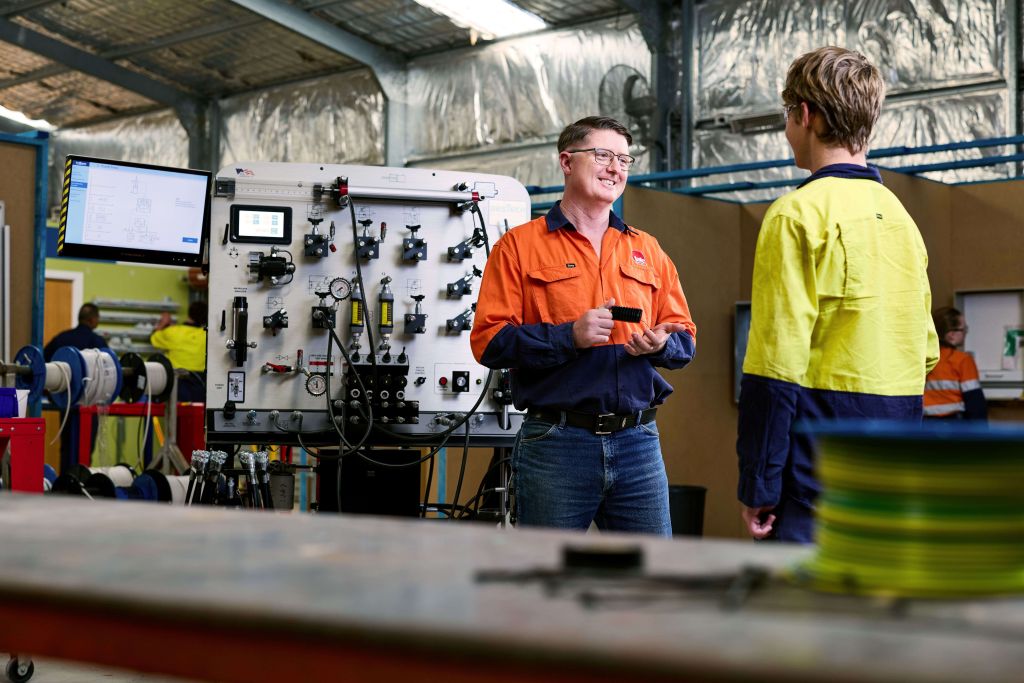 Two men are talking in the workshop